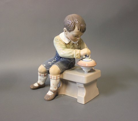 Boy with spinning top, no. 1205 by Dahl Jensen.
Great condition
