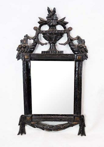Rococo mirror with black painted wooden frame with carvings, in great antique 
condition from the 1780s.
5000m2 showroom.