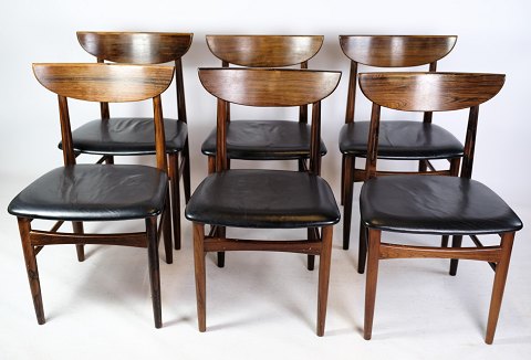 A set of six dining table chairs of Danish design in rosewood with black leather 
from around the 1960s.
Dimensions in cm: H: 76 W: 46 D: 48 SH: 44
Great condition
