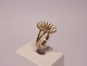 Daisy ring in gilded 925 sterling silver and enamel, stamped BH by Bernhard 
Hertz.
5000m2 showroom.
