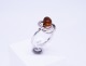 Ring of 925 sterling silver, decorated with amber and twisted silver, stamped 
EF.
5000m2 showroom.