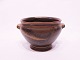 Ceramic bowl with handles and dark brown glaze from the 1960s.
5000m2 showroom.