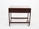 Side table on wheels with shelf of rosewood and of danish design from the 1960s.
5000m2 showroom.