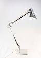 Bordlampe af rustfrit stål og af italiensk design, af Flos.
5000m2 udstilling.