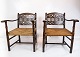 A pair of antique armchairs of dark wood and papercord from the 1920s.
5000m2 showroom.
