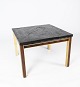 Coffee table with slate plate,  frame of gilded metal and rosewood by Bendixen 
Design from the 1970s. 
5000m2 showroom.