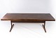 Coffee table in rosewood with shaker legs of danish design from the 1960s. 
5000m2 showroom.