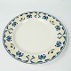 Dinner plate decorated with yellow and blue colours from the 1960s. 
5000m2 showroom.
