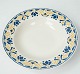 Deep dinner plate decorated with blue and yellow colours from the 1960s. 
5000m2 showroom.