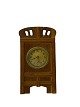 Fireplace clock of oak and the dial is of brass, from around the 1920s. 
5000m2 showroom.
Good condition

